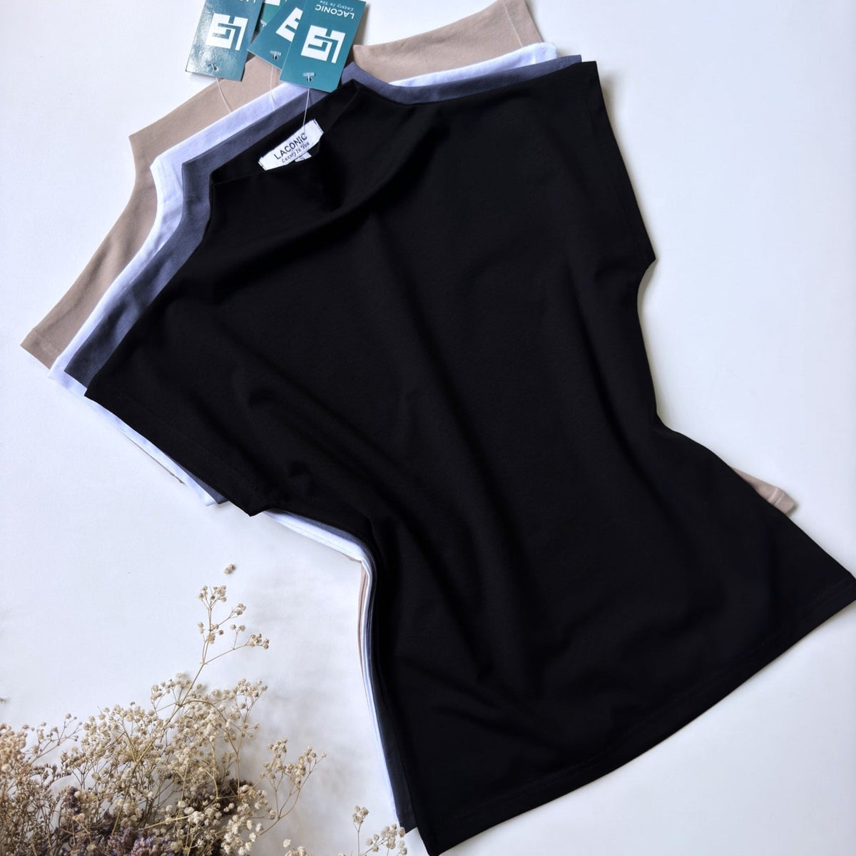 A navy blue fitted top with a mock neck and cap sleeves