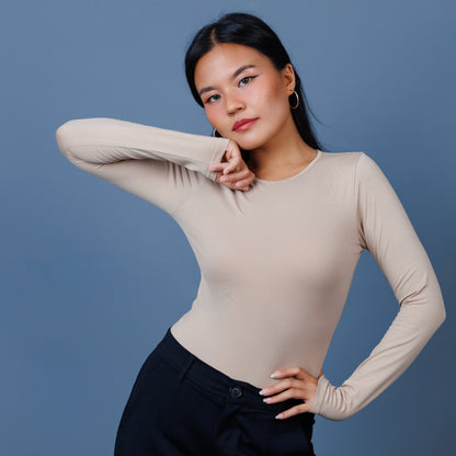 Crewneck full sleeve bodysuit, bodysuit, #bodysuit, ladies bodycon top, one-piece top, swimwear, smartwear, innerwear, laconic bodysuit, cream, nude, beige, model, onlinenepal, nepalibrand, sexytop, partywear, dress, body-hugging