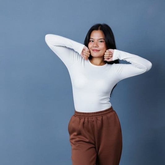 Model wearing Laconic Fashion Nepal crewneck full sleeve bodysuit in white
