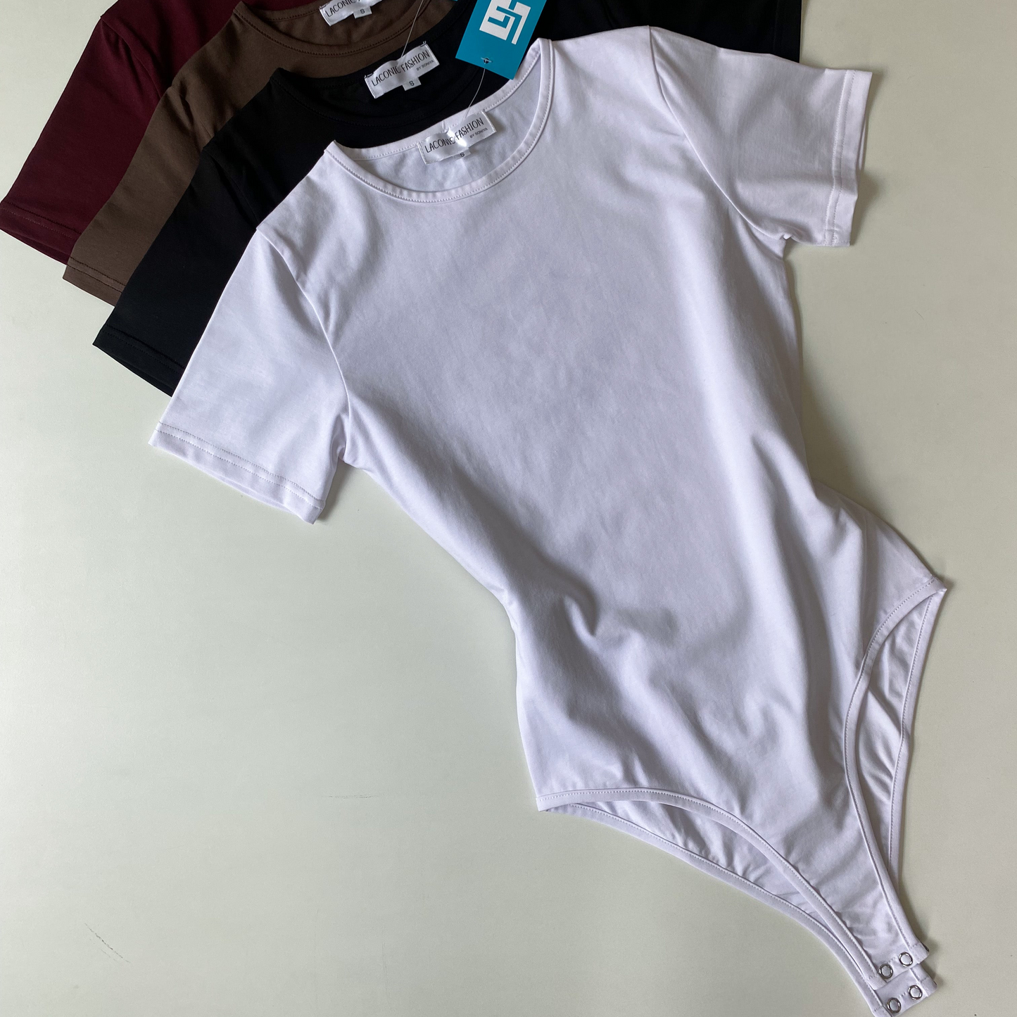 Crewneck Half - Sleeve Bodysuit